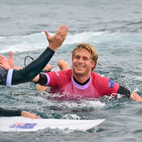 Australia’s Ethan Ewing celebrates at the end of the 8th heat.