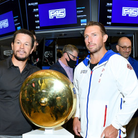 Better days: F45 founder Adam Gilchrist (right) and shareholder Mark Wahlberg on the floor of the New York Stock Exchange in 2021.