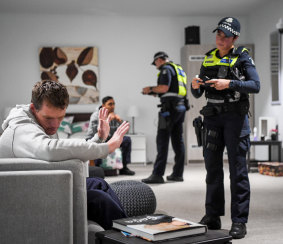 First responders talk to same-sex couple “John” and “David” in a family violence training scenario at the Police Academy.