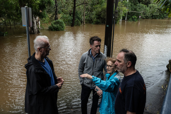 NSW Premier Chris Minns, Minister for Emergency Services Jihad Dib, and Lismore MP Janelle Saffin joined nervous Lismore residents to watch the river rise at the Browns Creek pumping station.