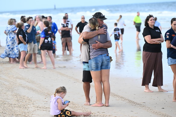 Mourners on the beach for Charlize. 