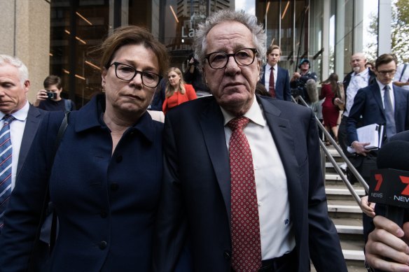 Geoffrey Rush and his wife Jane Menelaus leave the Federal Court in Sydney in 2019.