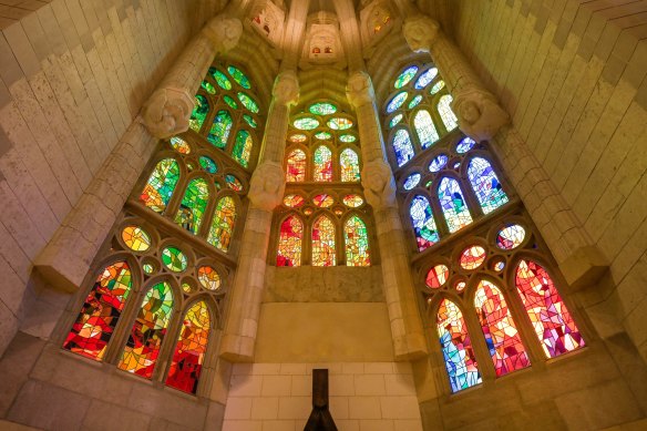 Stained-glass windows cast an otherworldly multi-hued light over the various spaces.