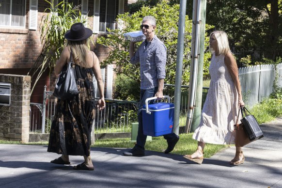 Staff of former premier Dominic Perrottet arrive at his house, armed with food for a barbecue at his place in Beecroft.