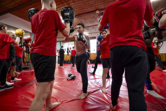 Boys at the academy spar before they start their studies. 