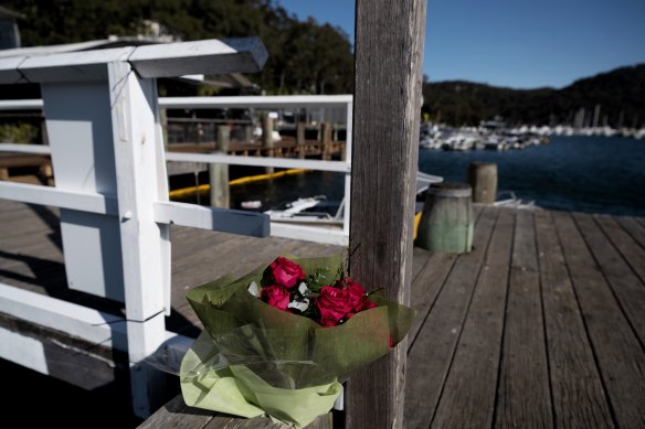 Flowers have been left at Church Point Wharf after a woman died in a boating accident in nearby Elvina Bay on Sunday night.