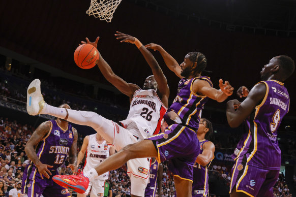 Ian Clark blocks Duop Reath at the rim.