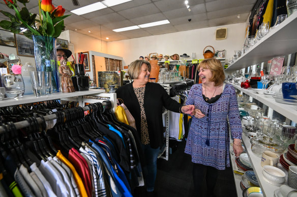 ‘We crack up’: Loretta King (left) and Debra Nichols volunteer at the Brotherhood of St Laurence op shop in Greensborough.