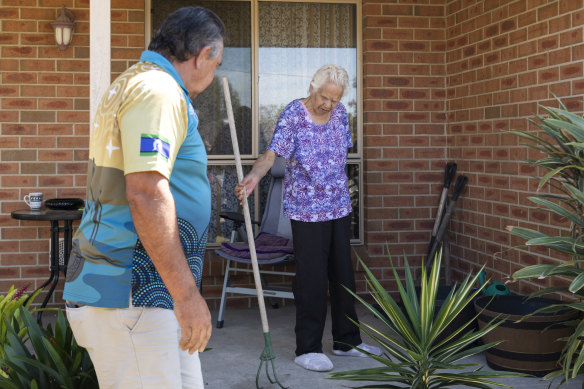 Booraja project manager Bunja Smith helps Veronica Holmes tidy the front yard of her Moruya home. 