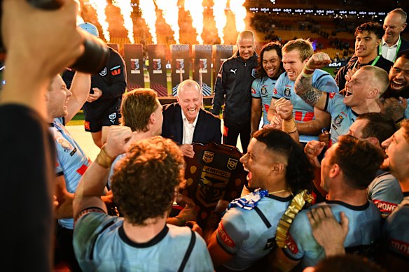 Michael Maguire and the Blues celebrate a remarkable and rare Origin series deciding win in Brisbane in 2024.