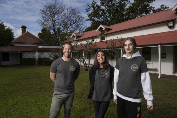 Key College School manager Nathanial Baker with students Mia and Lara.