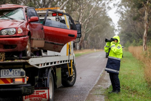 Police on Sunday at the scene of the car crash.