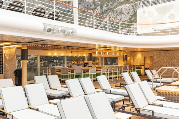 Deckchairs await passengers drawn to the infinity-edge plunge pool.