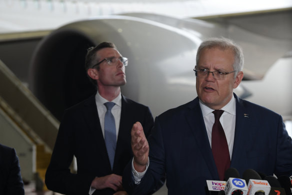 Prime Minister Scott Morrison and NSW Premier Dominic Perrottet at this morning’s press conference. 