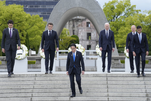 From left, Canada’s Justin Trudeau, France’s Emmanuel Macron, Japan’s Fumio Kishida, US’s Joe Biden, Germany’s Olaf Scholz, and Britain’s Rishi Sunak, walk back after placing a wreath at the Hiroshima Peace Memorial Park on Friday.