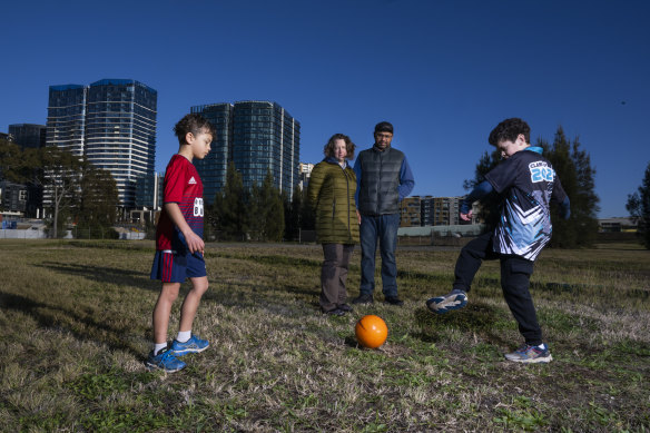 Amy and Francisco de Paula with sons Felix and Toby on the government-owned site at Wentworth Point that is slated for development.