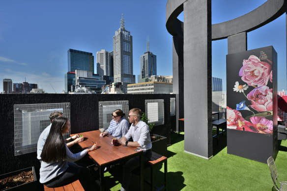 Patrons at the rooftop bar at the Pullman hotel on Monday. 