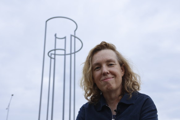 Artist Natasha Johns-Messenger pictured with her newly installed work Compass 2023 on Peninsula Link.