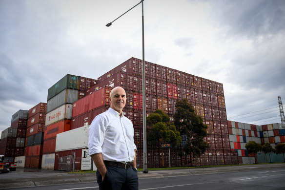 Andrew Coldrey, vice-president for the Asia Pacific region of global logistics firm CH Robinson, in front of stacks of empty shipping containers at the port.