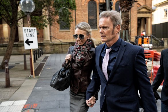 Craig McLachlan arrives at court this week with his partner Vanessa Scammell.