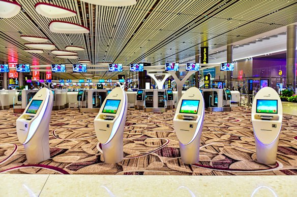 Self check-in kiosks at Singapore’s Changi Airport.