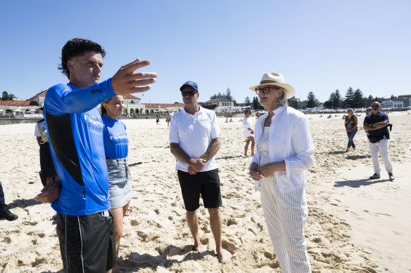 Chase Hardaker, Anna Christowski and   
Bruce Hopkins at Bondi Beach with Governor-General Sam Mostyn.