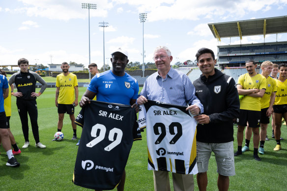 Sir Alex Ferguson visits Macarthur FC, coached by Dwight Yorke (left), and with captain Ulises Davila (right).