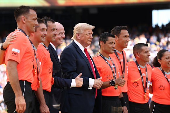 Donald Trump with FIFA president Gianni Infantino and referee Alireza Faghani (to the right of Trump).