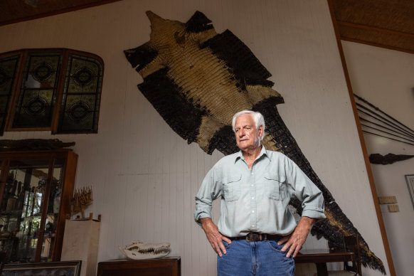 The skin of Buka the black croc on display behind John Lever at Koorana Crocodile Farm, where Buka spent decades after being trapped until dying at almost 100 years old.