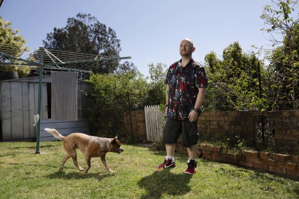 Jay Johnson and his dog, Echo. Johnson raided his superannuation to fund life-changing bariatric surgery.