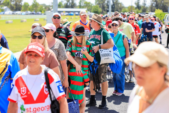 Fans file into Glen Willows Oval, Mudgee, before kick-off.
