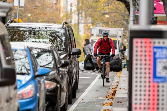A cyclist on a narrow Melbourne bike lane.
