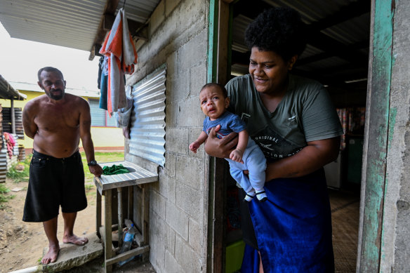 Villagers Abel and Kelera Raidaveta with their baby Luke. 
