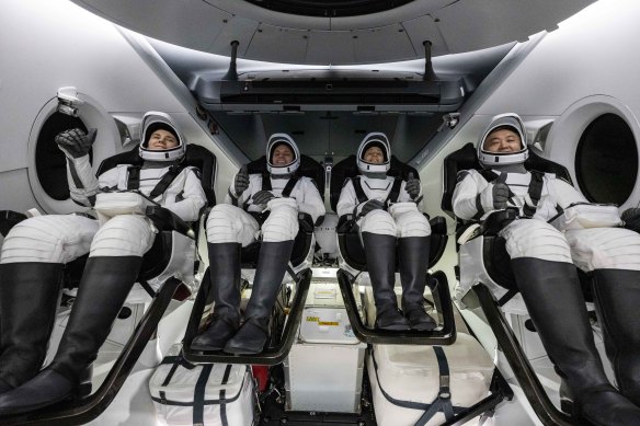 Roscosmos’s Anna Kikina, NASA’s Josh Cassada and Nicole Mann and Japan Aerospace Exploration Agency’s Koichi Wakata in a SpaceX craft after having landed in the Gulf of Mexico on March 11.