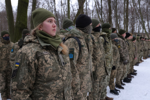 Civilians take part in Kiev Regional Defense Unit training in a forest in Ukraine in January.