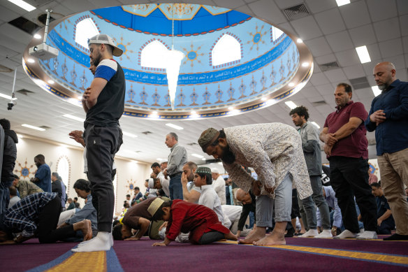People gather at Lakemba Mosque for Friday prayers today.
