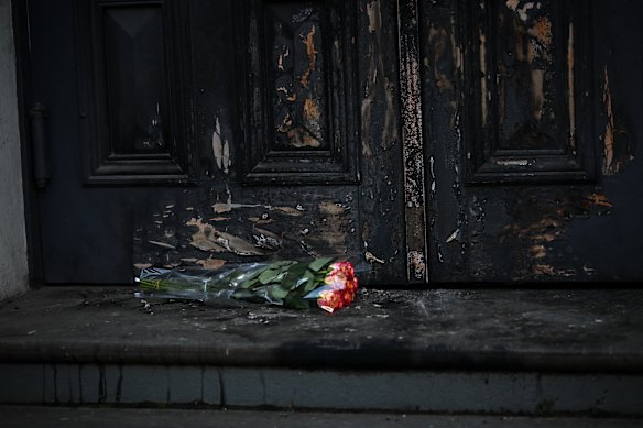 Flowers laid at the East Melbourne Synagogue’s charred doors earlier this month.