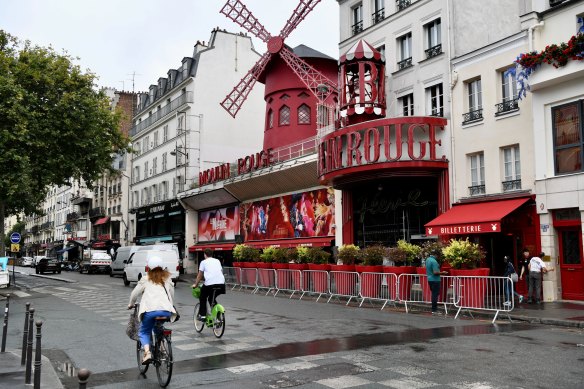 The Boulevard de Clichy in Montmartre is a popular nightlife strip in Paris home to the famous Moulin Rouge cabaret.