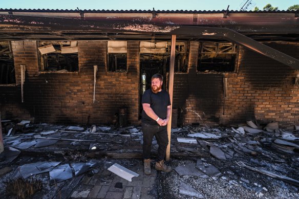 Damon Henricksen visiting the family home of his parents and extended family that was destroyed in the fire. Damon and his immediate family moved out two years ago but many of his possessions were still there.
