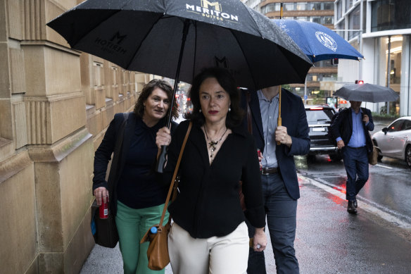 Professor Carola Garcia de Vinuesa, centre, arriving at the Kathleen Folbigg inquiry in Sydney.