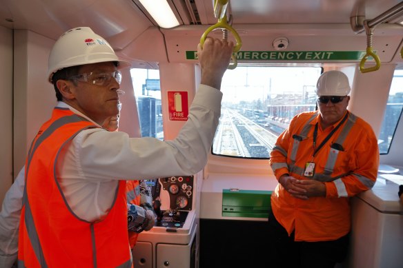 Premier Chris Minns, left, on one of the driverless trains undergoing testing on the new line between Sydenham and Chatswood.