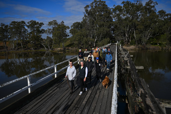 Residents walking over Kirwans Bridge. 