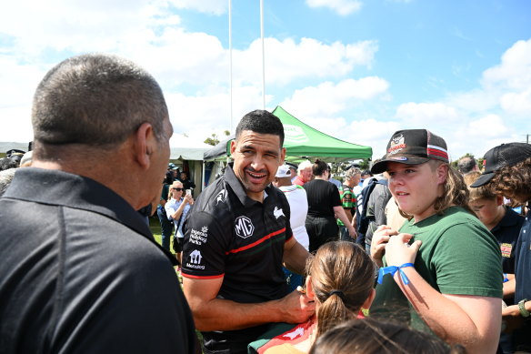 South Sydney player Cody Walker signing autographs.