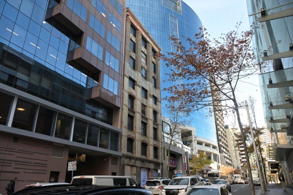 The abandoned building at 82-84 Sussex Street, in the middle, was bought by the Wakil family in 1984.