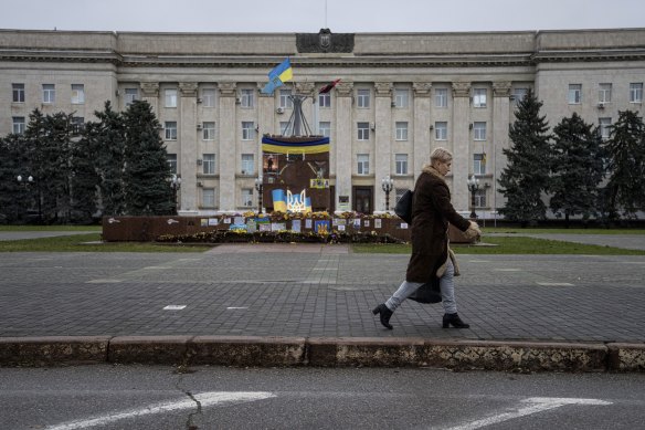 A woman in the city centre of Kherson on Saturday. Russian forces now pound Kherson city daily.