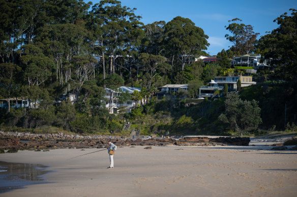 Houses overlooking Narrawallee Beach have sold for up to $12 million.