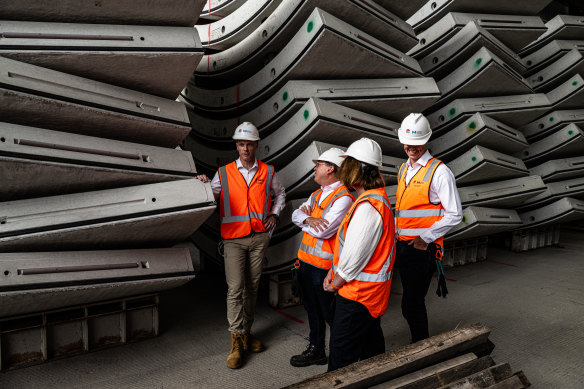 Premier Chris Minns (left) chats to Sydney Metro chief executive Peter Regan at a giant construction site near Rosehill Racecourse. 