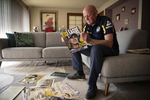 Brad Arthur’s father Ted at his Blackheath home look over his Eels memorabilia.