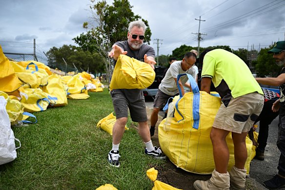 Residents collect sandbags from a council depot in Morningside.