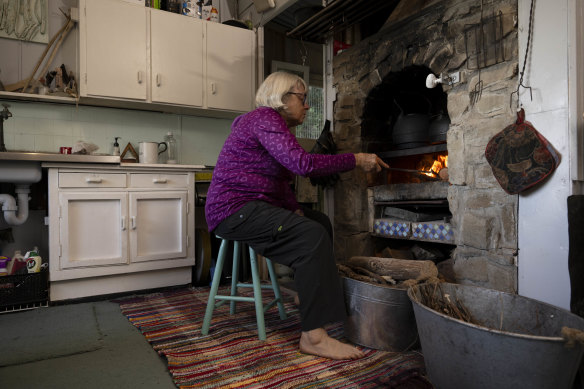 Lynne Ambler in the shack her father built at Era.